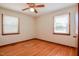 Bedroom with hardwood floors and two windows at 11234 N Nc Hwy 50, Benson, NC 27504