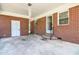 Red brick carport with doors leading into the house at 11234 N Nc Hwy 50, Benson, NC 27504