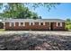 Exterior shot of a brick home featuring white trim and a well-kept yard at 11234 Nc Hwy 50, Benson, NC 27504