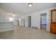 Spacious kitchen with white appliances, cabinets and trim, and light tile floors at 11234 Nc Hwy 50, Benson, NC 27504
