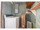 Laundry room equipped with a washing machine, dryer, and vintage decor elements at 11234 Nc Hwy 50, Benson, NC 27504