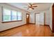 Bright living room with hardwood floors, large window and ceiling fan at 11234 Nc Hwy 50, Benson, NC 27504