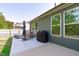 Relaxing backyard patio with lounge chairs and grill at 116 Alumroot Rd, Holly Springs, NC 27540