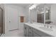Bathroom featuring a double vanity and framed mirror at 116 Alumroot Rd, Holly Springs, NC 27540
