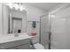 Modern bathroom features a glass enclosed shower and vanity at 116 Alumroot Rd, Holly Springs, NC 27540