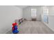 Bright bonus room featuring comfortable carpeting and ample space at 116 Alumroot Rd, Holly Springs, NC 27540