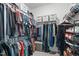 Walk-in closet with clothing and storage solutions at 116 Alumroot Rd, Holly Springs, NC 27540