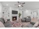 Inviting living room features a fireplace and neutral decor at 116 Alumroot Rd, Holly Springs, NC 27540