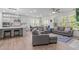 Spacious living room leads to the kitchen, with open concept design at 116 Alumroot Rd, Holly Springs, NC 27540