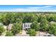 Aerial view of a lovely home and the surrounding wooded neighborhood at 116 Weaver Mine Trl, Chapel Hill, NC 27517