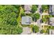 Aerial view of a home in a leafy neighborhood, showcasing its well-maintained roof and back deck at 116 Weaver Mine Trl, Chapel Hill, NC 27517