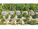 An aerial view of a neighborhood with tree-lined streets and well-maintained lawns at 116 Weaver Mine Trl, Chapel Hill, NC 27517