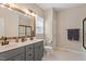 Bathroom featuring double sinks, a large mirror, and modern fixtures at 116 Weaver Mine Trl, Chapel Hill, NC 27517