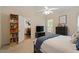 Bedroom view showcases a bookcase, TV, and view to another room with a dining table at 116 Weaver Mine Trl, Chapel Hill, NC 27517