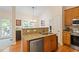Kitchen featuring a sink, granite counters, and stainless appliances at 116 Weaver Mine Trl, Chapel Hill, NC 27517