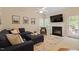 Inviting living room with fireplace, comfortable seating, and backyard access at 116 Weaver Mine Trl, Chapel Hill, NC 27517