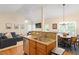 Open-concept living space featuring kitchen, living room, and dining area at 116 Weaver Mine Trl, Chapel Hill, NC 27517