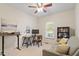 Home office featuring two desks, a sofa, and a window for natural light at 116 Weaver Mine Trl, Chapel Hill, NC 27517