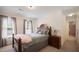 Bedroom with a wood bedframe, plush throw, and soft curtains at 1258 Jamestowne Dr, Elon, NC 27244