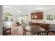 Dining area with large windows and door leading to an outdoor space at 1258 Jamestowne Dr, Elon, NC 27244