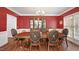 Formal dining room featuring hardwood floors, a decorative chandelier, and elegant decor at 1258 Jamestowne Dr, Elon, NC 27244