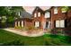 Charming red brick home featuring manicured landscaping and a walkway leading to the front entrance at 1258 Jamestowne Dr, Elon, NC 27244