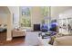 Bright living room with high ceilings, large windows, fireplace, and comfortable seating at 1258 Jamestowne Dr, Elon, NC 27244