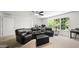 Relaxing room with a ceiling fan, large window, and comfy leather seating at 1258 Jamestowne Dr, Elon, NC 27244