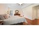 Cozy bedroom with hardwood floors, a dresser, and a comfortable bed at 1258 Jamestowne Dr, Elon, NC 27244