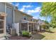 The backyard has a screen porch, partial fence, air conditioning units, and minimal landscaping at 127 Deacon Ridge St, Wake Forest, NC 27587