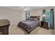 Carpeted main bedroom featuring a ceiling fan, window, furnishings, and ensuite bathroom at 127 Deacon Ridge St, Wake Forest, NC 27587