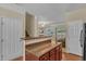 An open kitchen with a breakfast bar and hardwood flooring at 127 Deacon Ridge St, Wake Forest, NC 27587