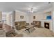 Spacious living room with fireplace, ceiling fan, and comfortable seating at 127 Deacon Ridge St, Wake Forest, NC 27587