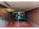 Large basement area with brick walls, utility connections, and extra space for recreation or storage at 1706 Carthage St, Sanford, NC 27330