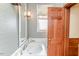 Charming bathroom featuring patterned wallpaper, a classic sink and a vintage mirror at 1706 Carthage St, Sanford, NC 27330