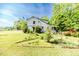 Two story home with a well-manicured lawn and blossoming shrubs, exudes curb appeal at 1706 Carthage St, Sanford, NC 27330