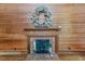 Close-up of living room with fireplace, decorated with a wreath at 1706 Carthage St, Sanford, NC 27330