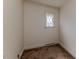 Small room with neutral walls and a diamond-patterned window at 1706 Carthage St, Sanford, NC 27330