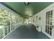 Expansive screened porch with a green ceiling, ideal for enjoying the outdoors at 1706 Carthage St, Sanford, NC 27330