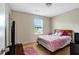 Simple bedroom with a bed, a window, and a TV, ideal for relaxation at 1743 Longshadow Dr, Burlington, NC 27217