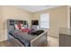 Comfortable bedroom with ample natural light, a sleek TV, and a cozy bed at 1743 Longshadow Dr, Burlington, NC 27217