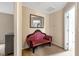 Cozy hallway area featuring accent seating and a mirror, creating a warm and inviting space at 1743 Longshadow Dr, Burlington, NC 27217