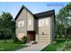 New construction two-story home with brick and vinyl siding plus an attached garage in a landscaped front yard at 1809 Bennett St, Raleigh, NC 27604