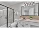 Bathroom featuring a vanity with framed mirror, shower with glass door, and a toilet at 201 Bog Hill Ln, Cary, NC 27519