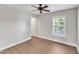 Bedroom with hardwood floors, natural light from the window, and a ceiling fan at 201 Bog Hill Ln, Cary, NC 27519
