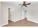 Bedroom with hardwood floors, natural light from the windows, and two entrances at 201 Bog Hill Ln, Cary, NC 27519