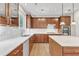 Beautiful kitchen with wood cabinetry, quartz countertops, stainless steel appliances and large kitchen island at 201 Bog Hill Ln, Cary, NC 27519