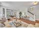 Bright living room showcasing an open floor plan, with hardwood floors and elegant design touches at 201 Bog Hill Ln, Cary, NC 27519