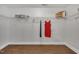 Bright walk-in closet with wood floors, shelving, and hanging rods to store your clothing and accessories at 201 Bog Hill Ln, Cary, NC 27519