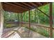 Outdoor deck area offering serene views of the surrounding foliage at 208 W Camden Forest Dr, Cary, NC 27518